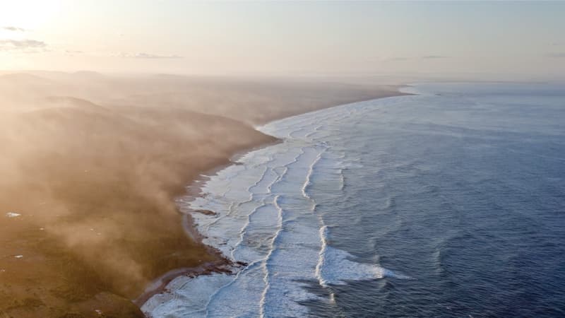 The shoreline of Southern Labrador full of active waves.