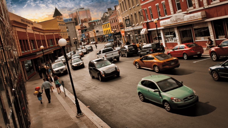 Traffic and passersby on a busy Water Street in St. John’s.