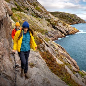 Two travellers are hiking part of the East Coast Trail.