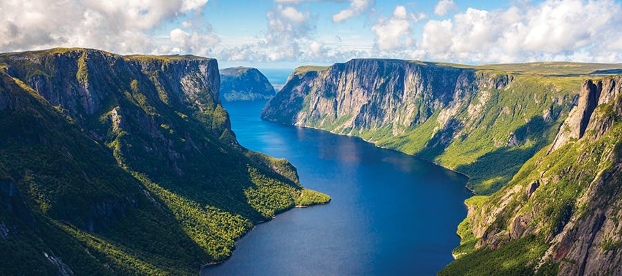 The towering mountain faces of Western Brook Pond Fjord, Gros Morne National Park.