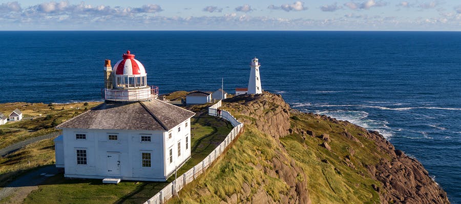 An aerial view of two lighthouses overlooking the ocean at Cape Spear National Historic Site.