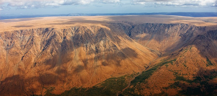 An aerial view of the mountain ranges of the Tablelands in Gros Morne National Park.